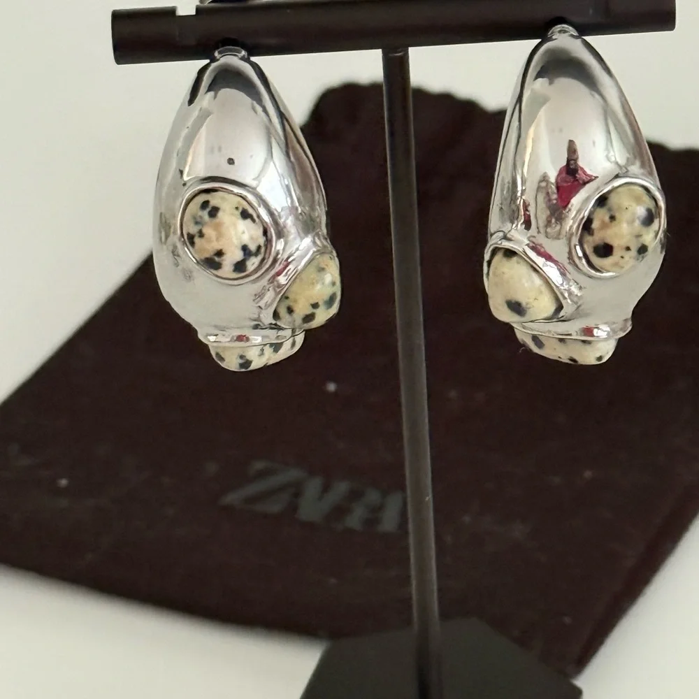 Zara EUC crescent shaped silver toned earrings with stones